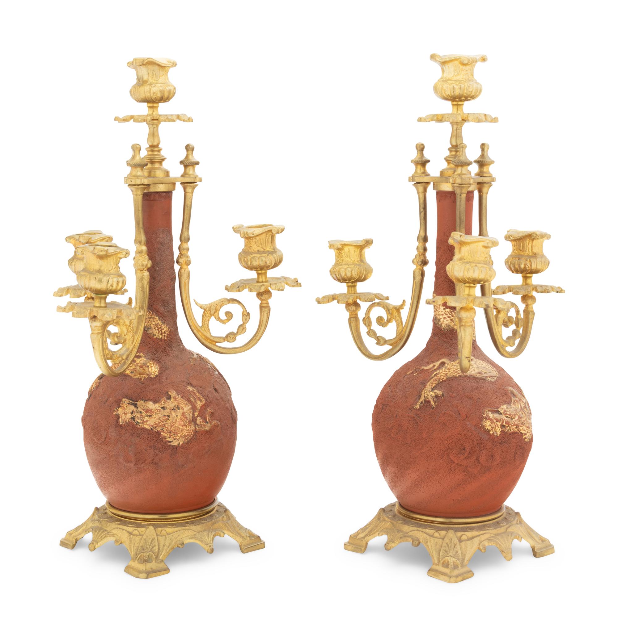 A Pair of Japanese Gilt Bronze Mounted Parcel Gilt Ceramic Four-Light Candelabra