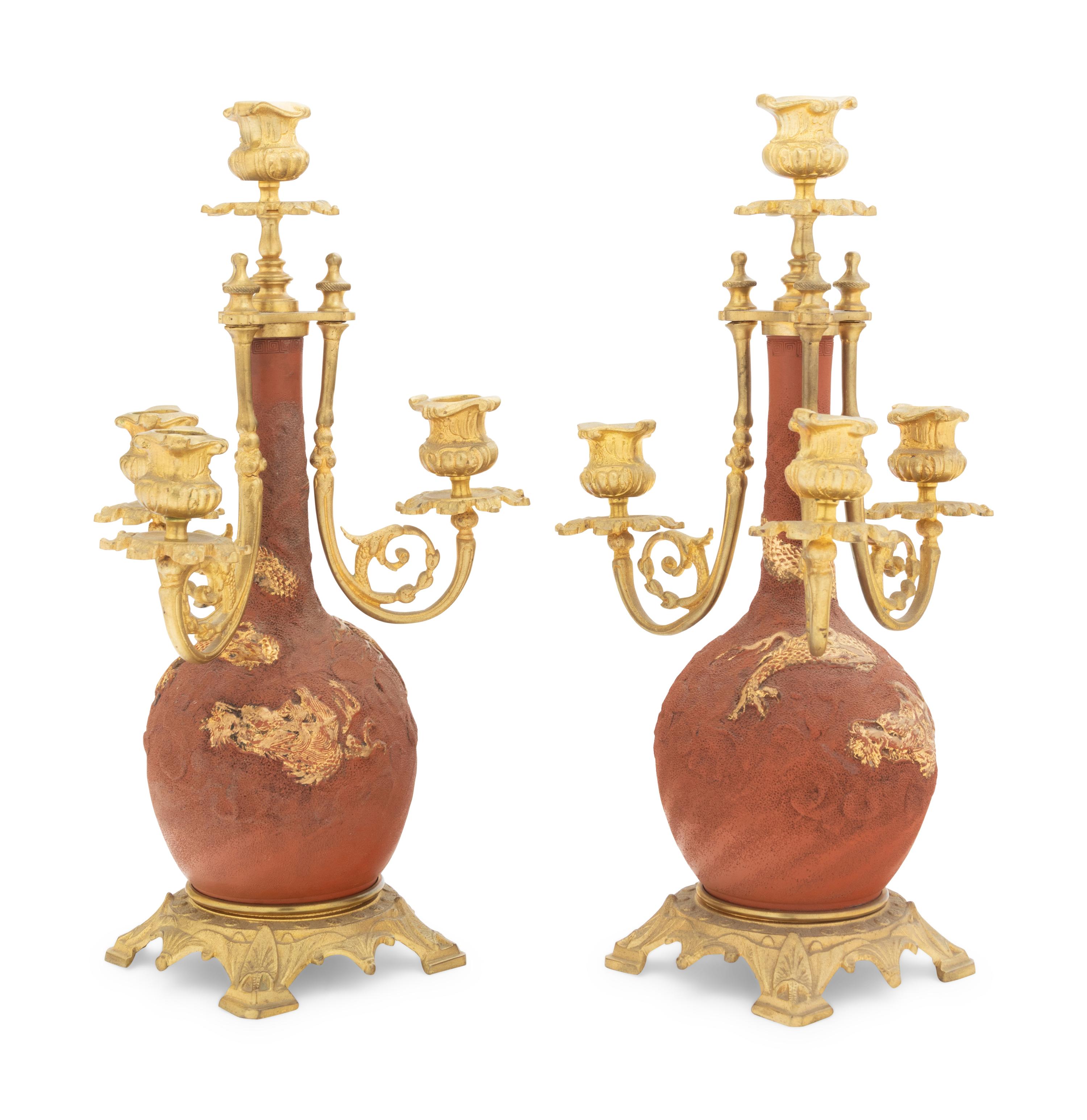 A Pair of Japanese Gilt Bronze Mounted Parcel Gilt Ceramic Four-Light Candelabra