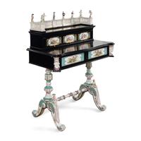 A German Ebonized and Porcelain Mounted Bureau
