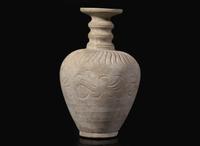 An unusual carved whiteware bottle vase, possibly Qingbai or Yueyao 白陶瓶 可能為青白或越窯