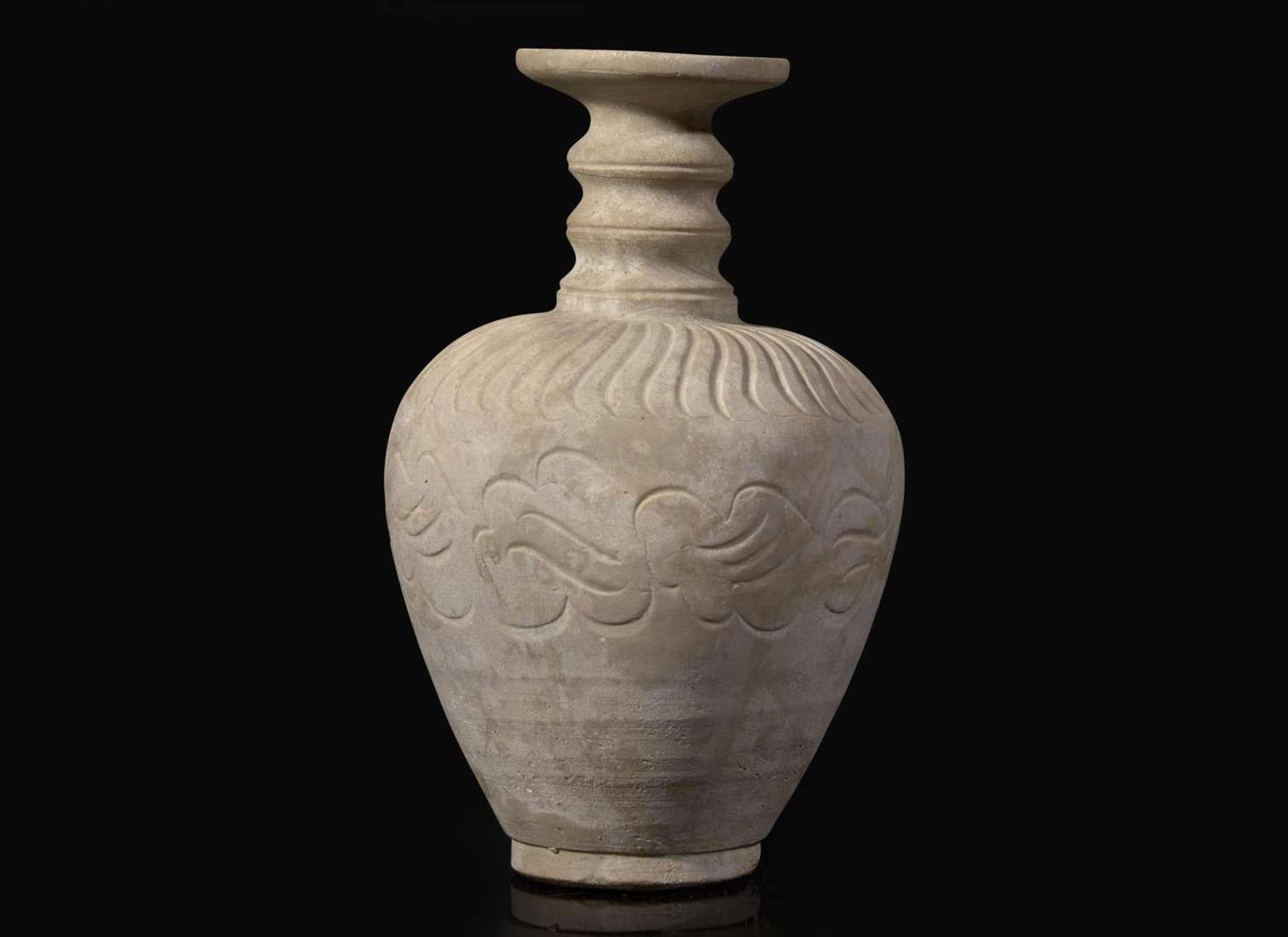An unusual carved whiteware bottle vase, possibly Qingbai or Yueyao 白陶瓶 可能為青白或越窯