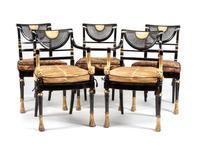 A Set of Twelve Regency Style Ebonized and Parcel Gilt Chairs Height 34 1/4 inches.