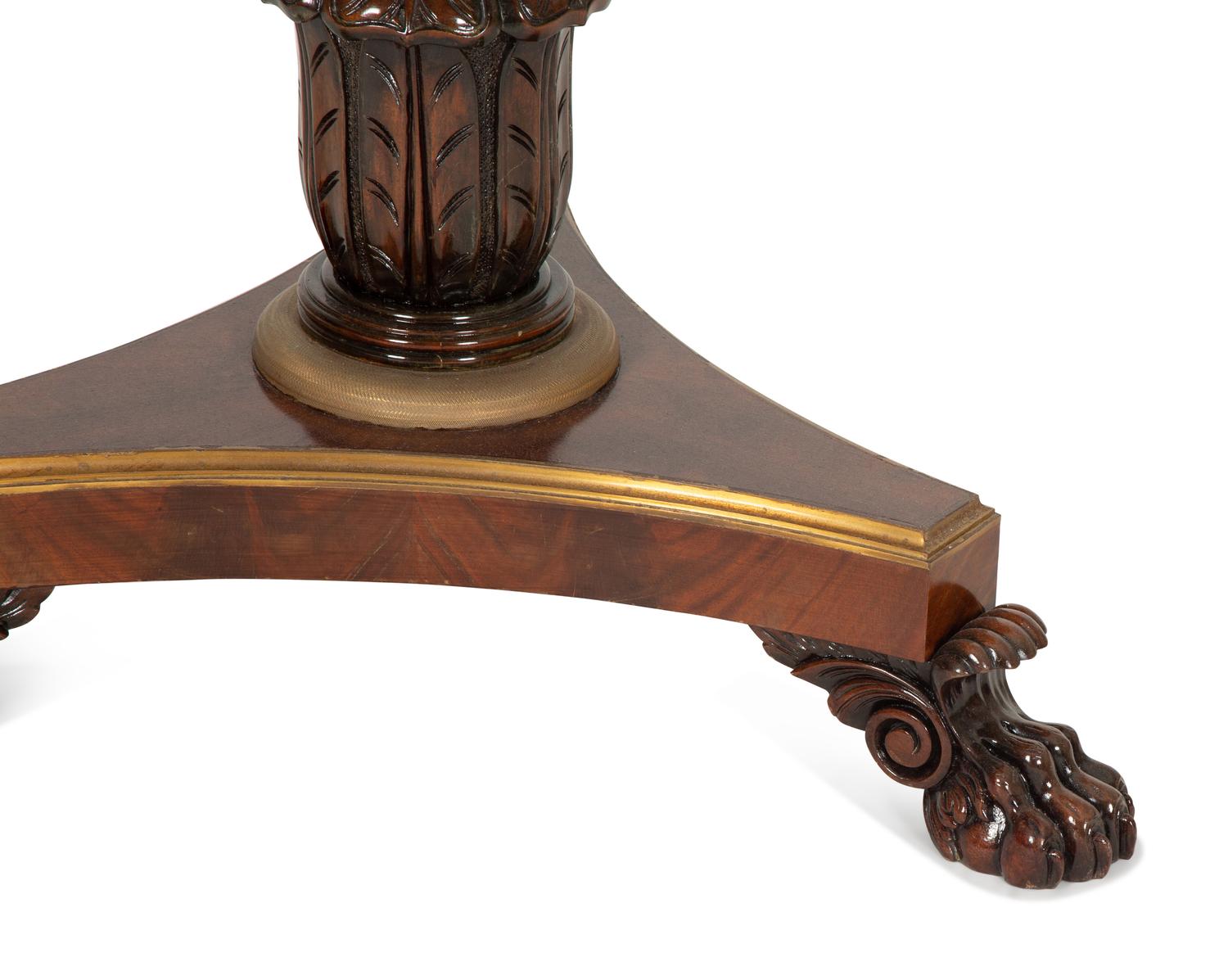 A Regency Style Mahogany and Rosewood Crossbanded Center Table with Inset Marble Top