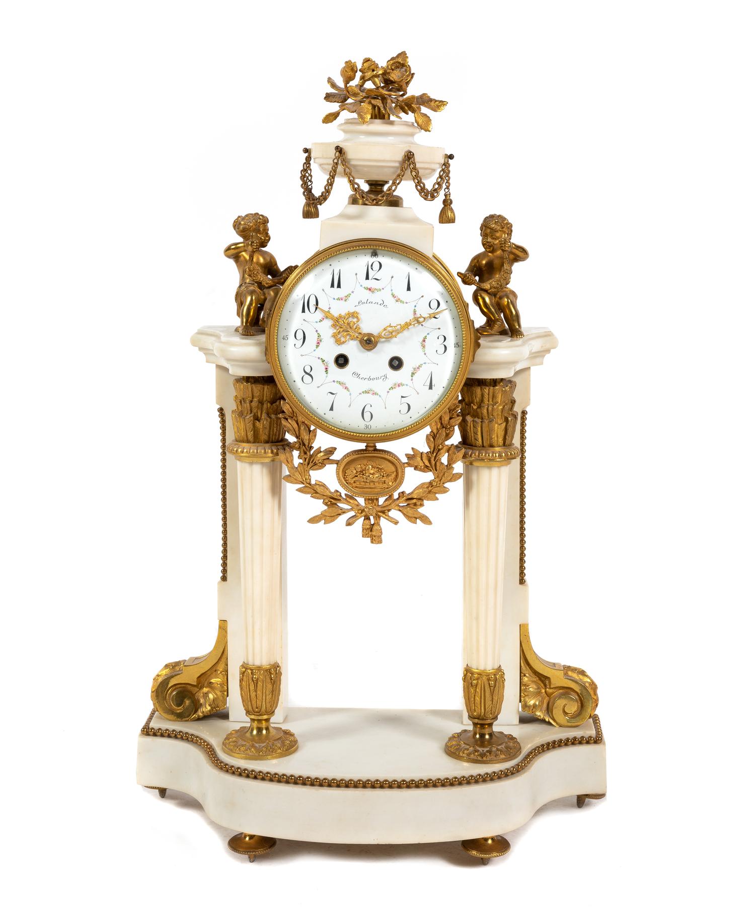 A Louis XVI Style Gilt Bronze Mounted Marble Mantel Clock