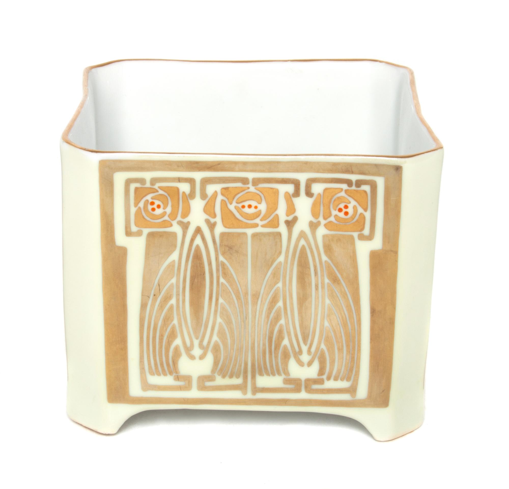 An Austrian Porcelain Cache Pot Height 4 1/4 x width 5 x depth 5 inches.