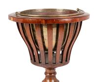 A Regency Style Mahogany Jardinière with Brass Liner