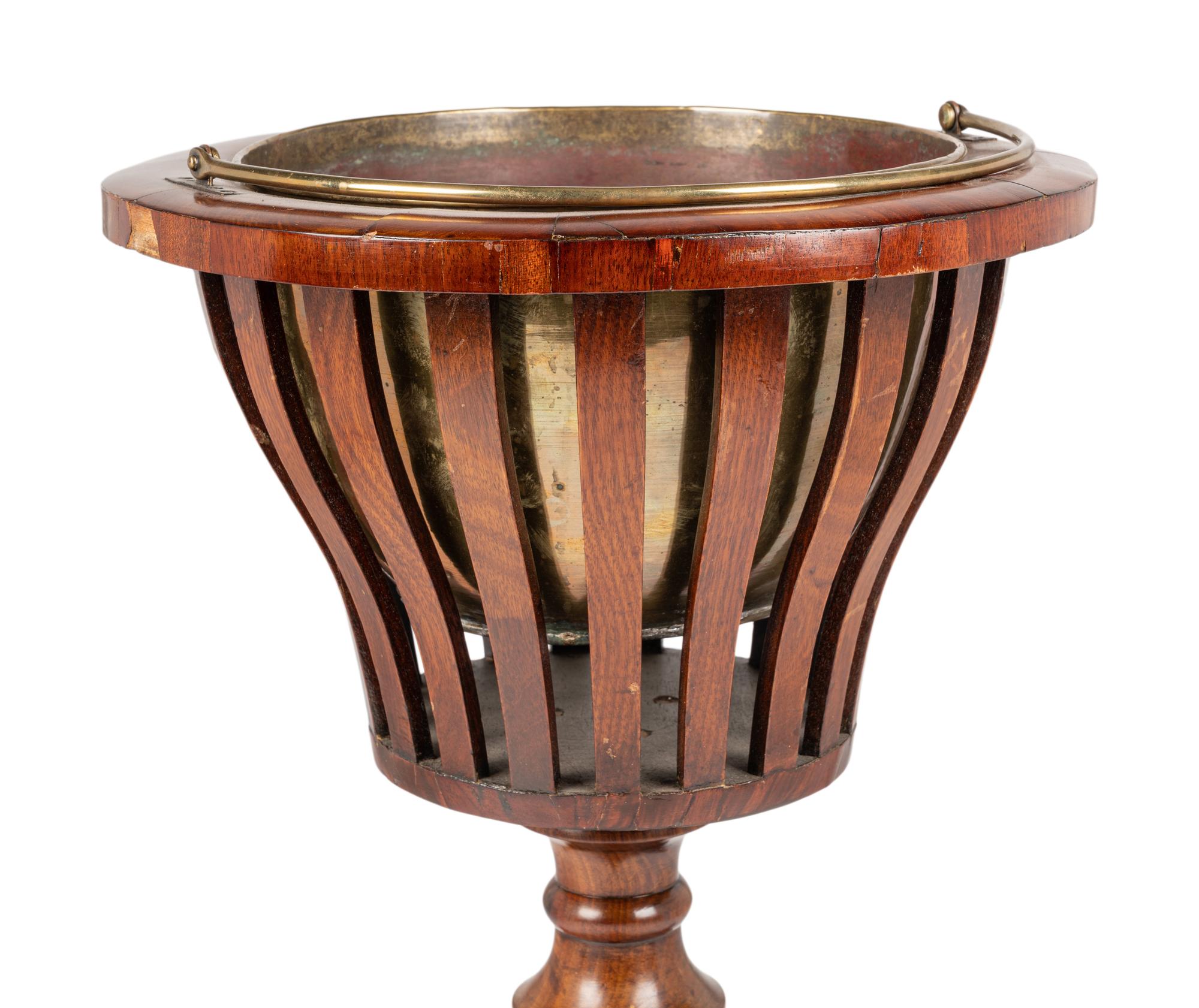 A Regency Style Mahogany Jardinière with Brass Liner