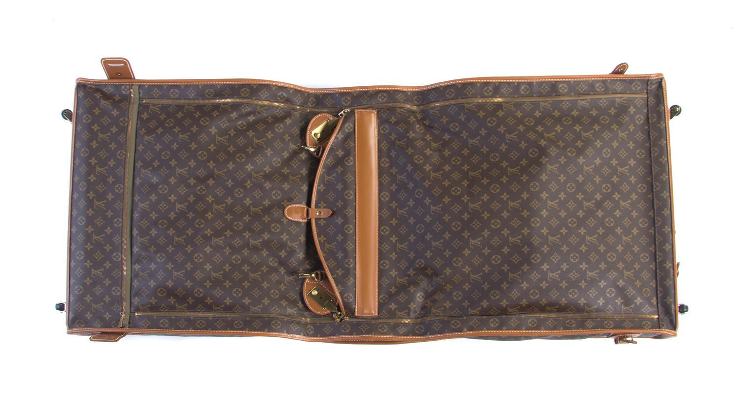 A Louis Vuitton Monogram Canvas Bi-Fold Garment Bag, 22 1/2 x 24 x 12 1/4 inches.