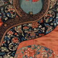 A Chinese Apricot Ground Embroidered 'Peony and Butterfly' Silk Semi-Informal Lady's Robe, Jifupao, late 18th/19th Century 清中期 杏子緞繡八團蝶戀花吉服袍