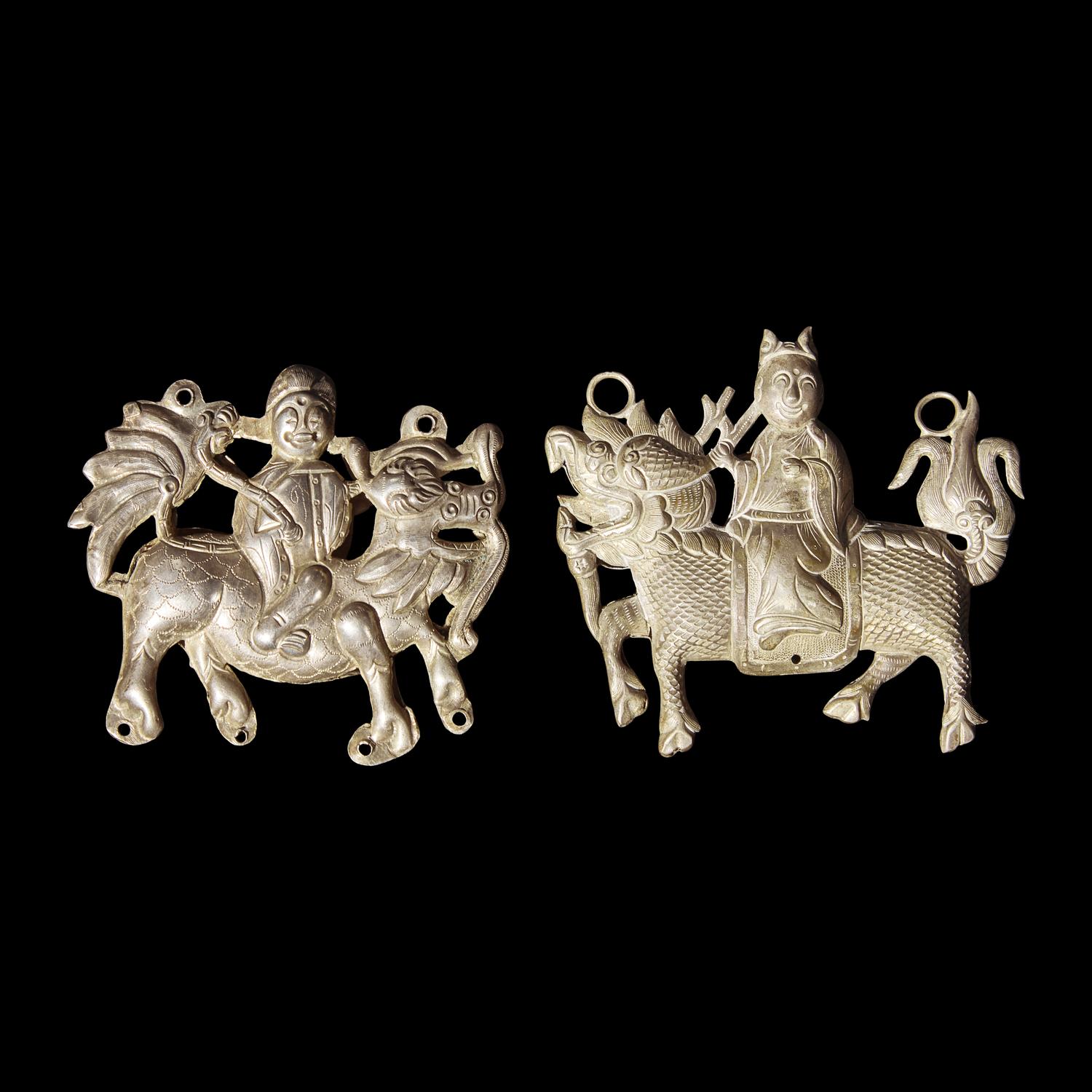 Eight Chinese Silver 'Boy and Qilin' Pendants, Late Qing Dynasty-Republic Period 晚清-民國 銀鍍金、銀燒藍及銀製麒麟送子長命鎖一組八件