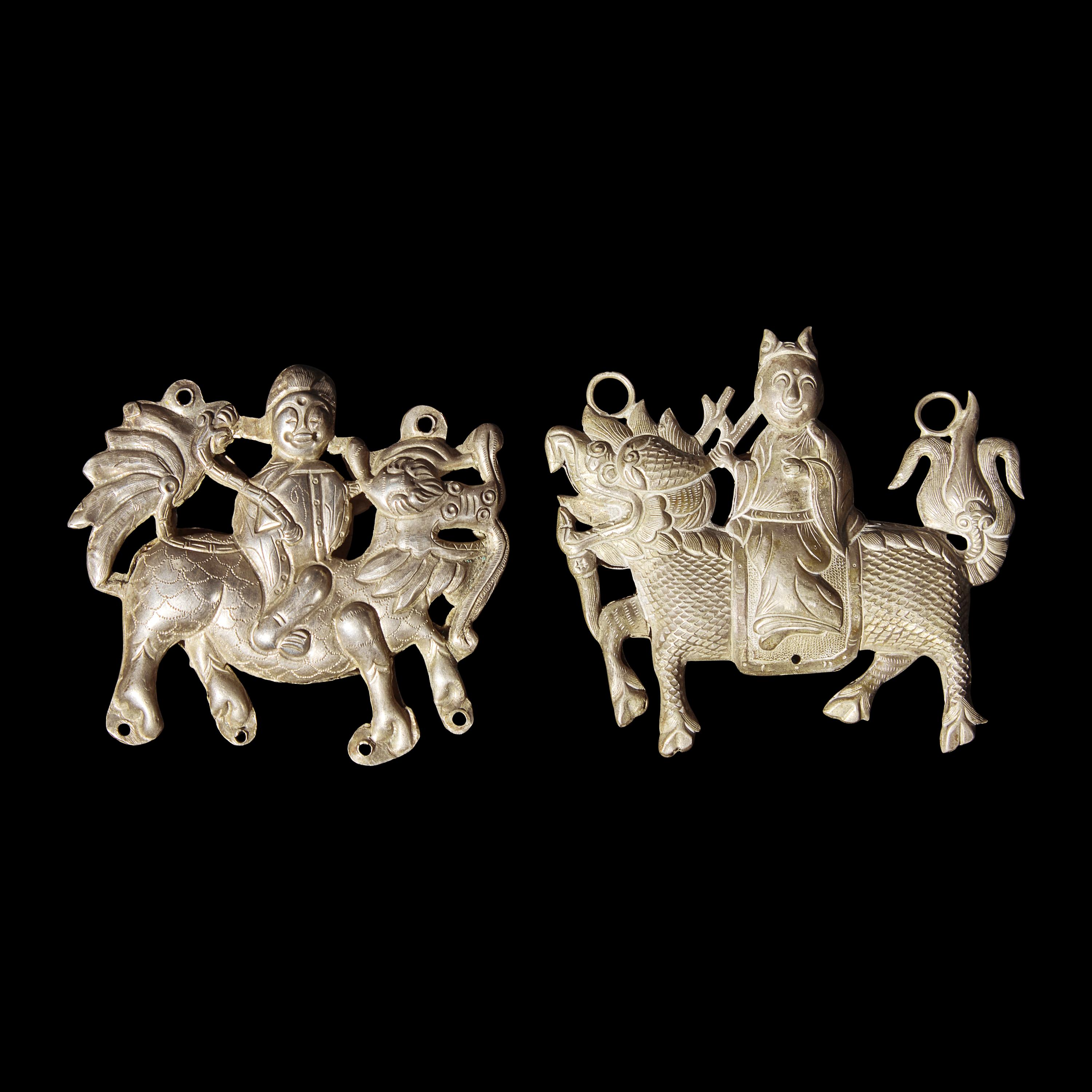 Eight Chinese Silver 'Boy and Qilin' Pendants, Late Qing Dynasty-Republic Period 晚清-民國 銀鍍金、銀燒藍及銀製麒麟送子長命鎖一組八件