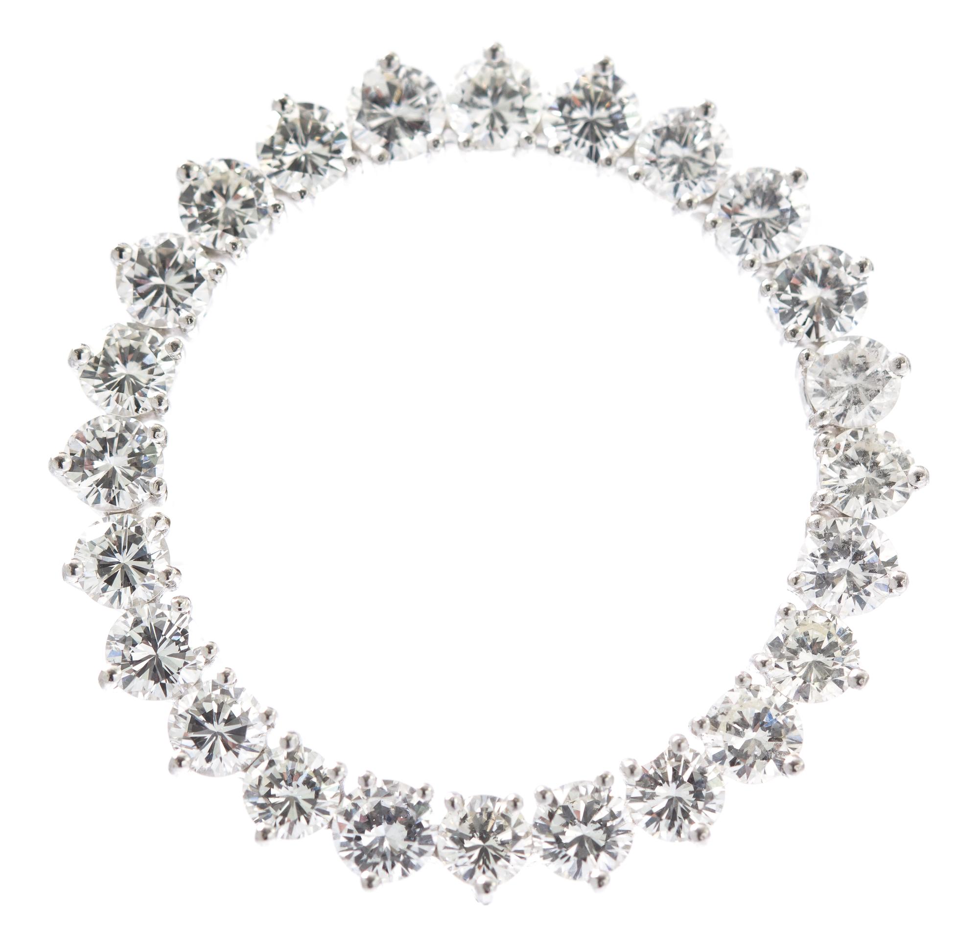 A Platinum and Diamond Circle Brooch, 6.80 dwts.