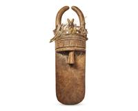 Primitive Mask with Feather and Fetishes
