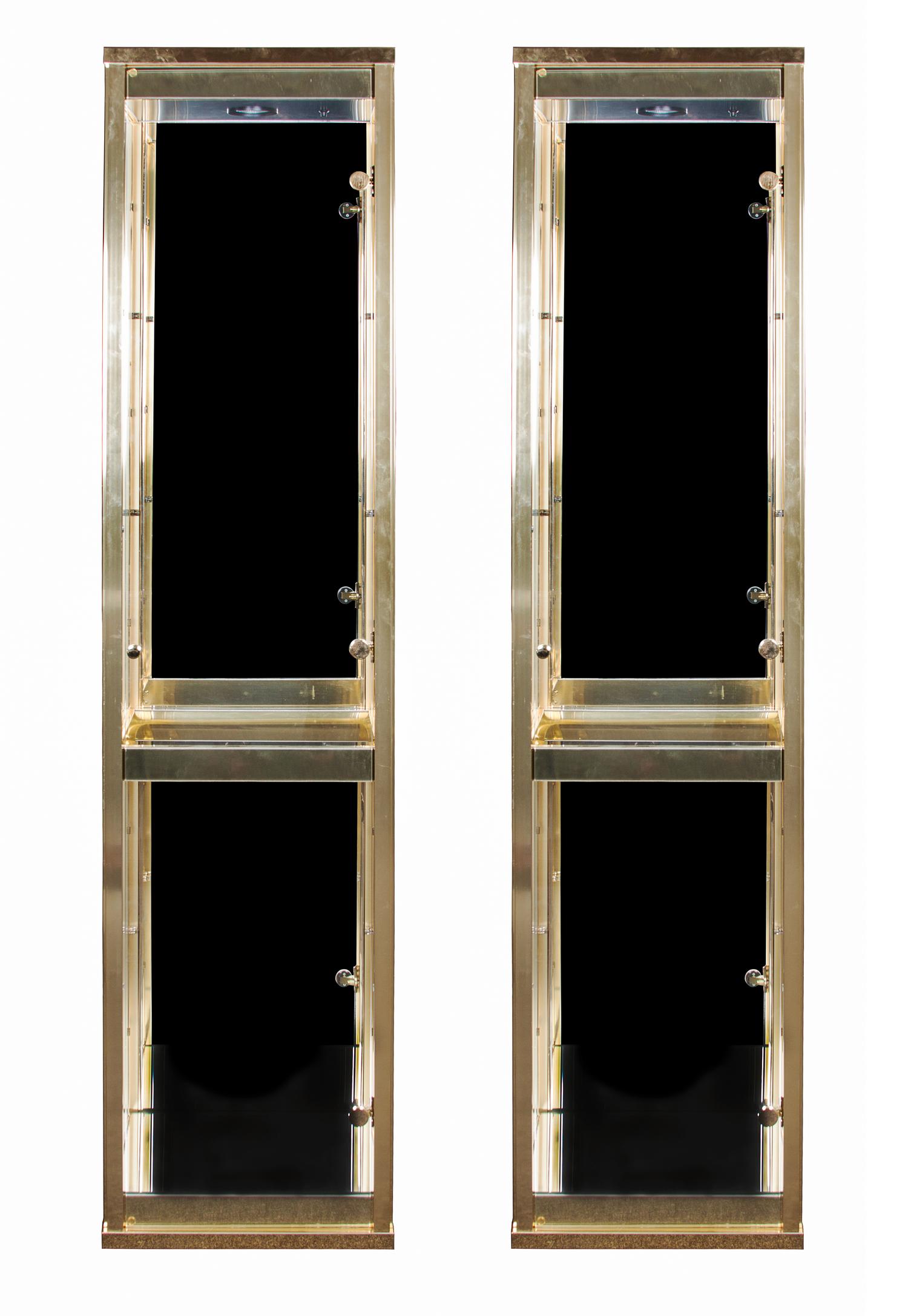 Two Brass and Glass Vitrines Height 74 1/4 x width 17 1/4 x depth 13 1/2 inches. — SECOND HALF OF 20TH CENTURY