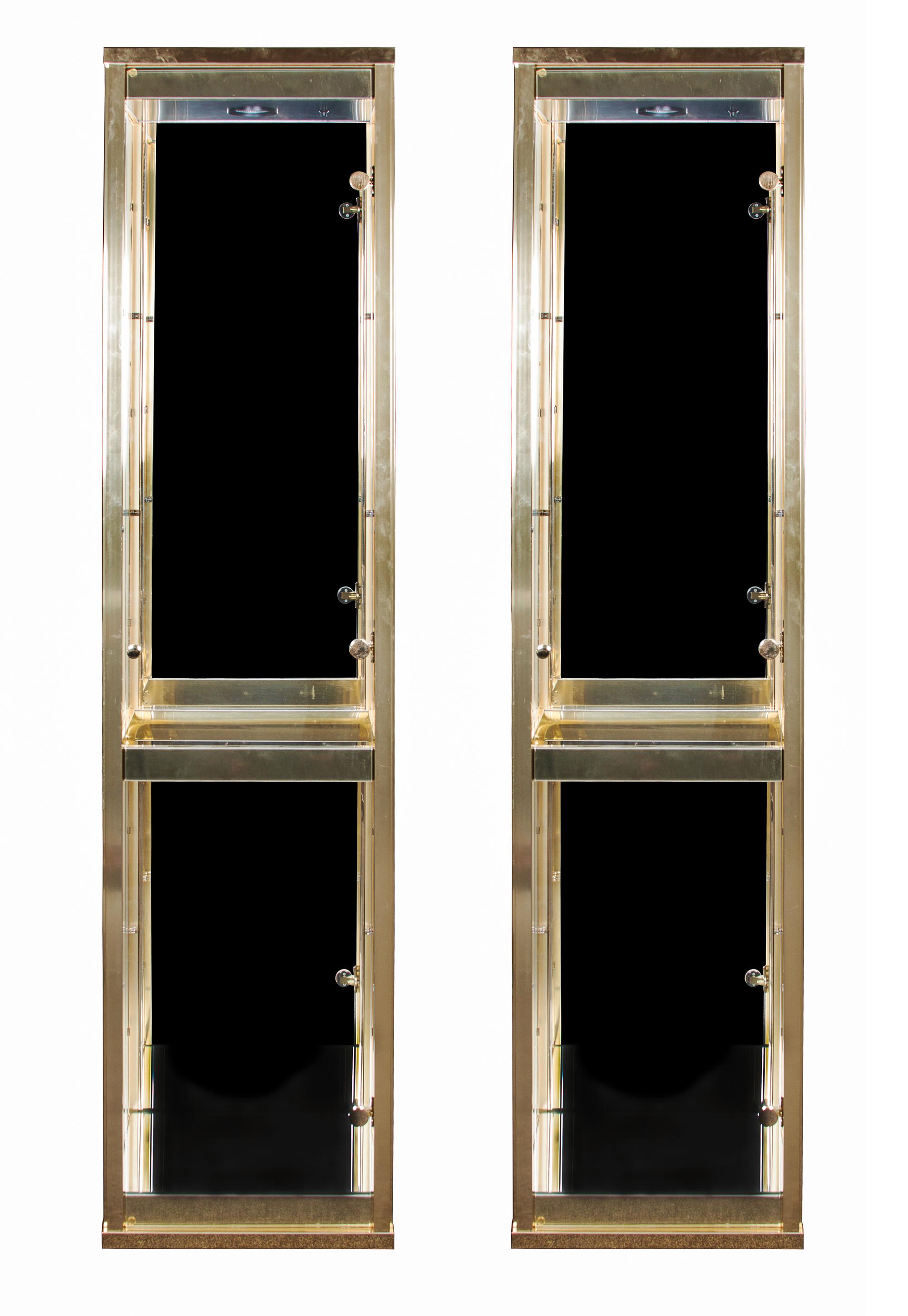 Two Brass and Glass Vitrines Height 74 1/4 x width 17 1/4 x depth 13 1/2 inches. — SECOND HALF OF 20TH CENTURY