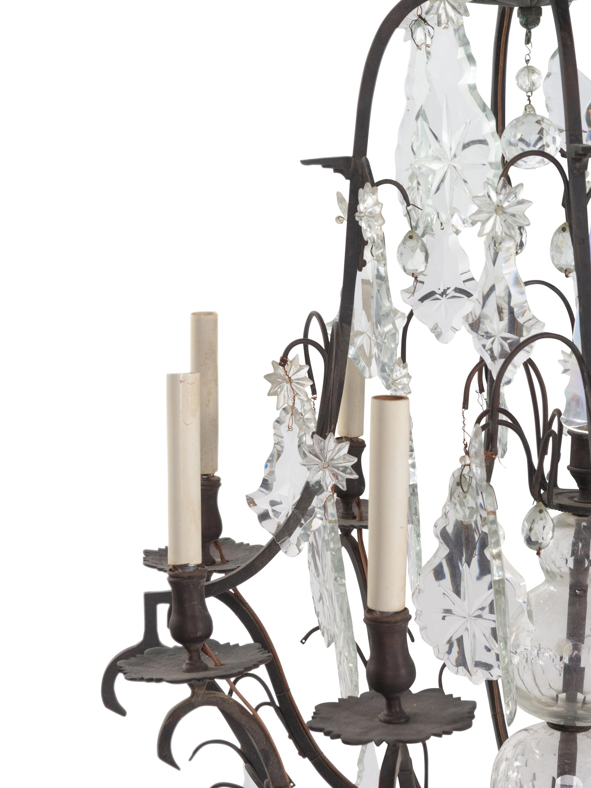 A Continental Cast Metal and Cut Glass Eight-Light Chandelier