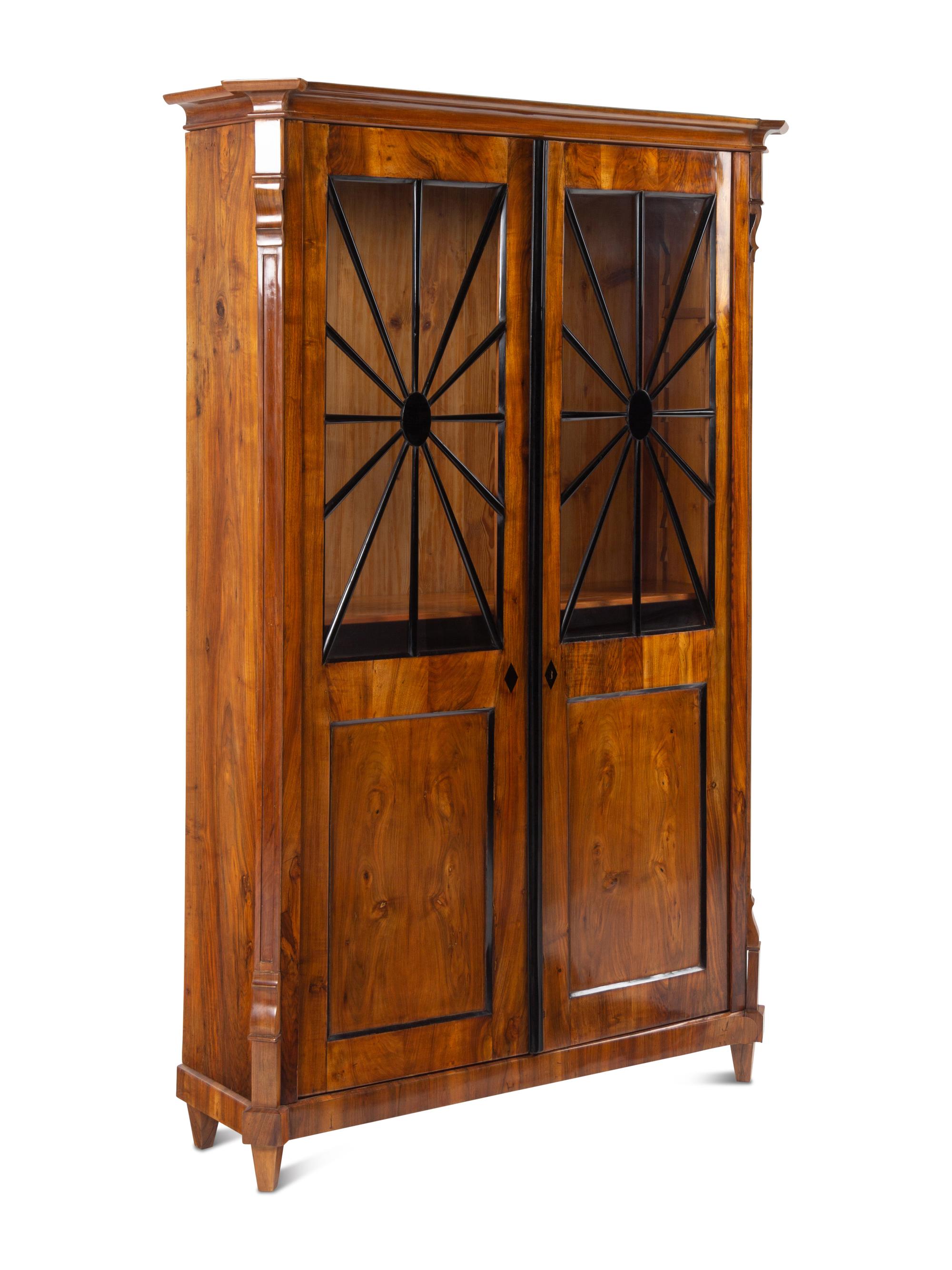 A Biedermeier Part-Ebonized Figured Walnut Bookcase