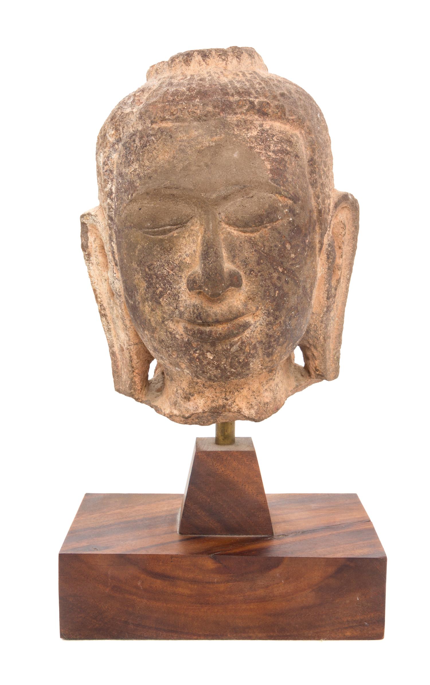 A Thai Stone Head of Buddha Height 7 3/4 inches.