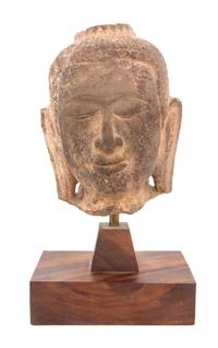 A Thai Stone Head of Buddha Height 7 3/4 inches.