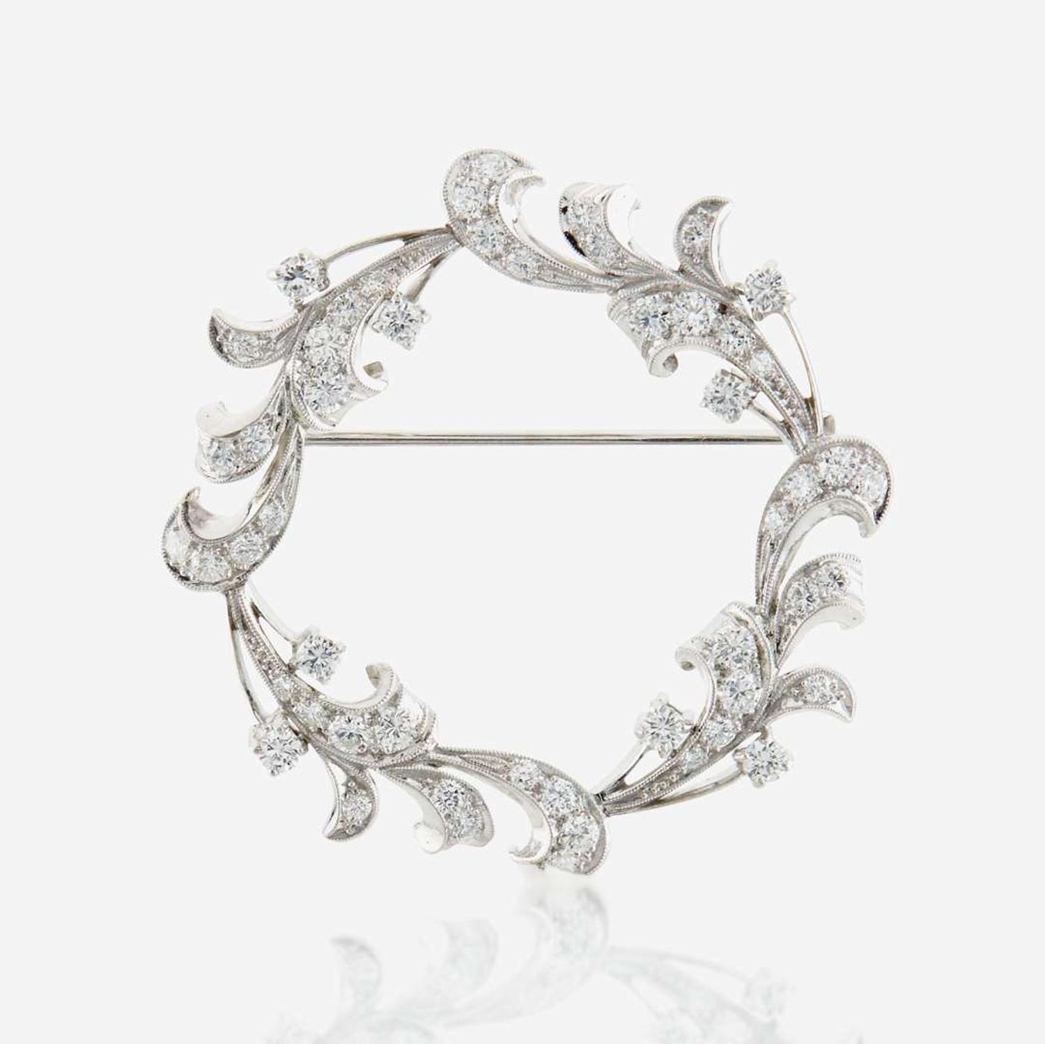 A diamond and platinum brooch