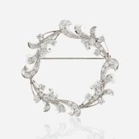 A diamond and platinum brooch