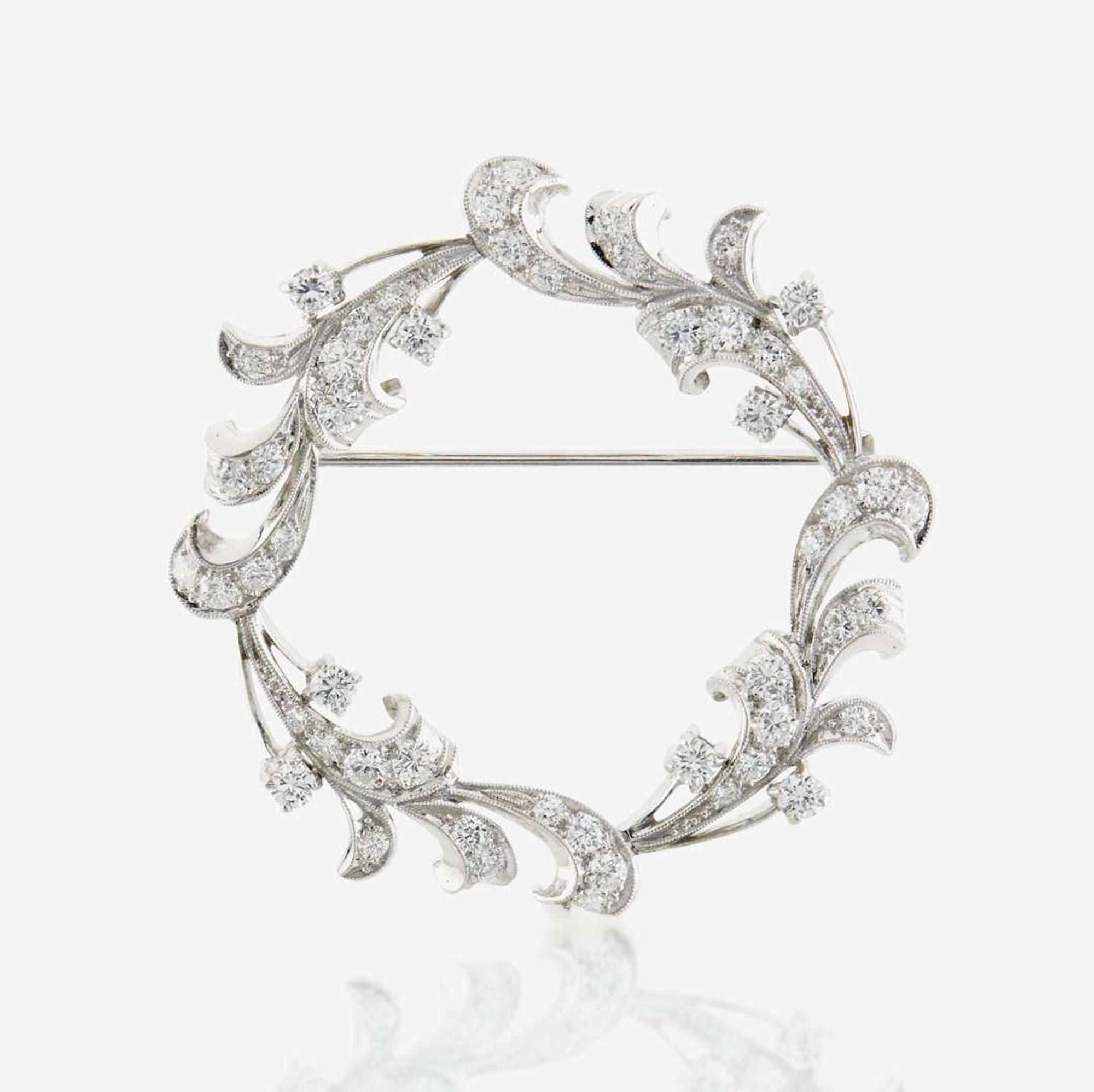 A diamond and platinum brooch
