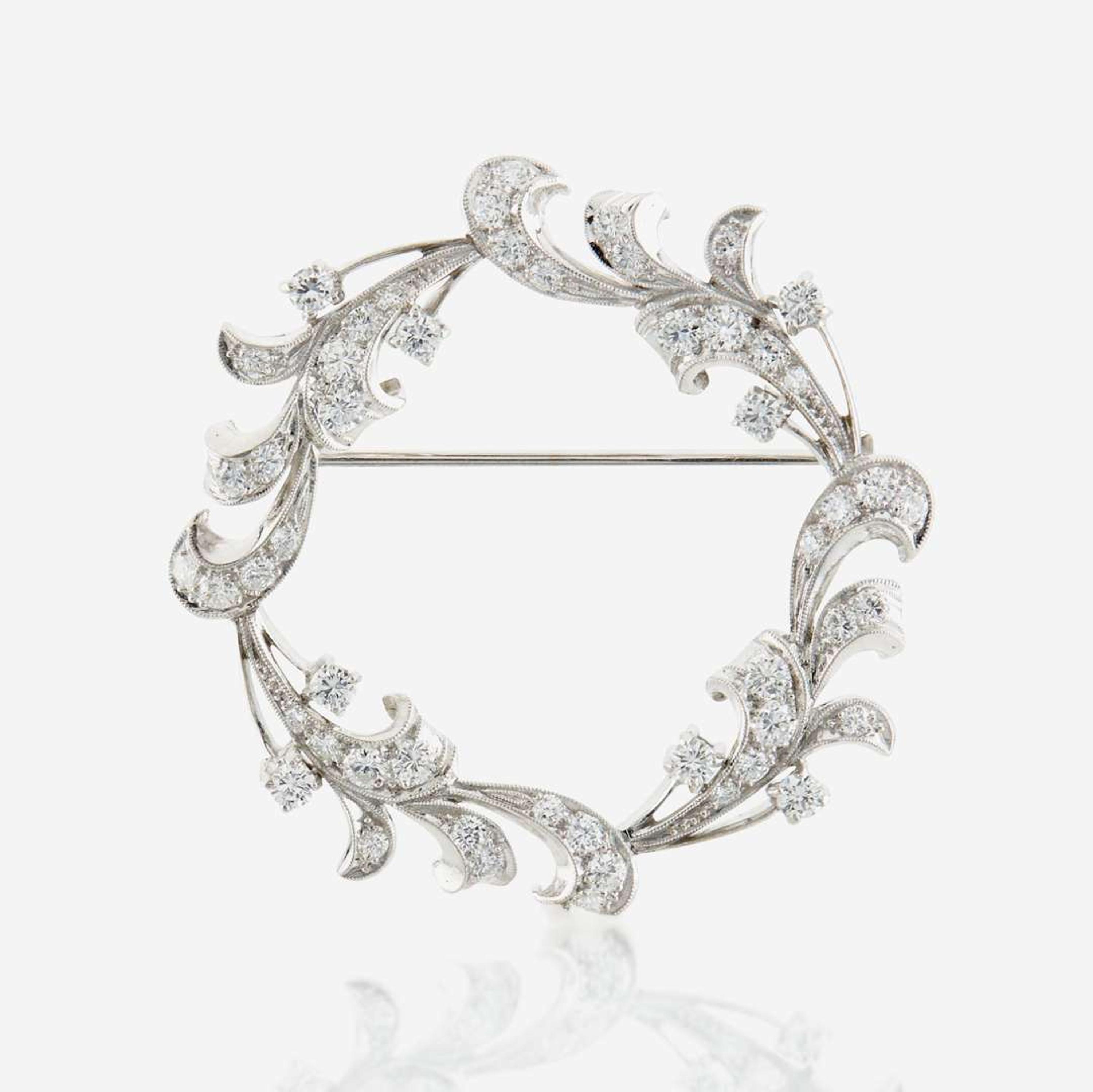 A diamond and platinum brooch