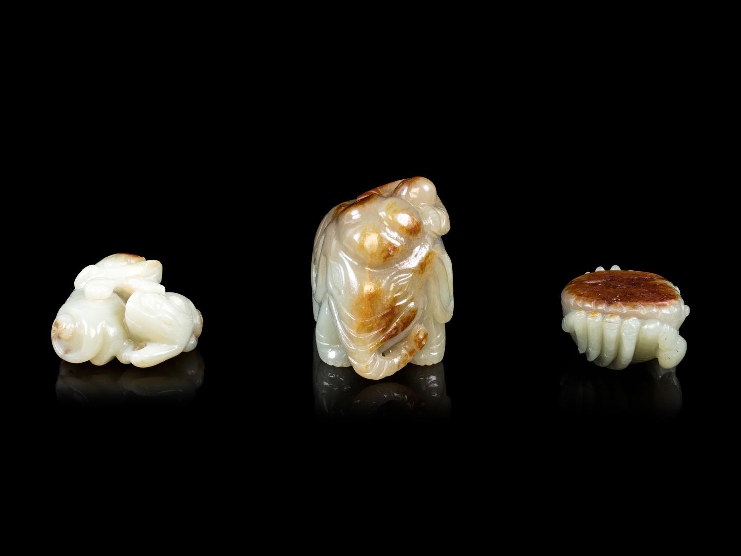 Three Jade Celadon and Russet Figures