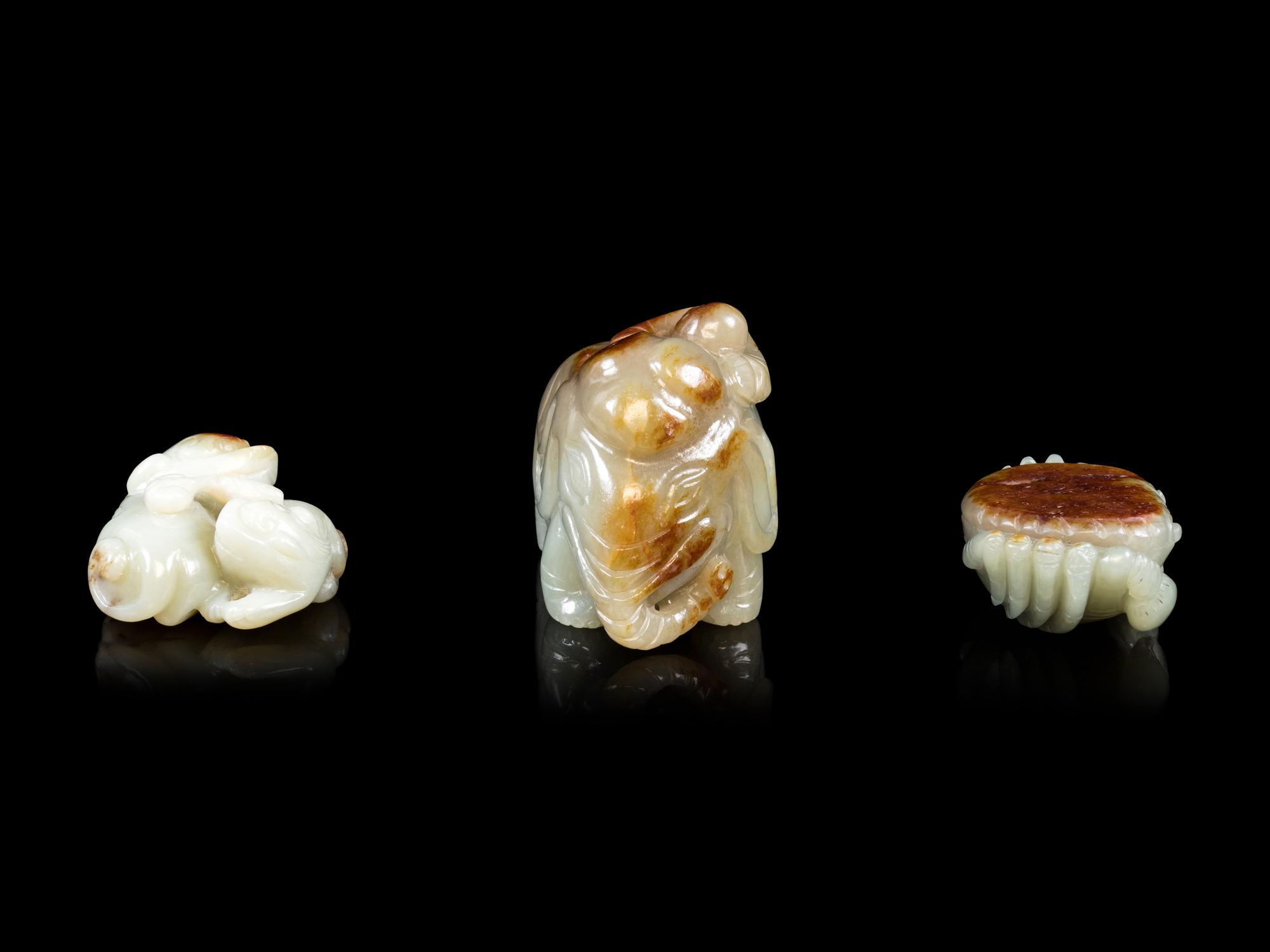 Three Jade Celadon and Russet Figures