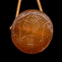 A Neo-Babylonian or Graeco-Persian Smokey Chalcedony Conoid Seal Necklace