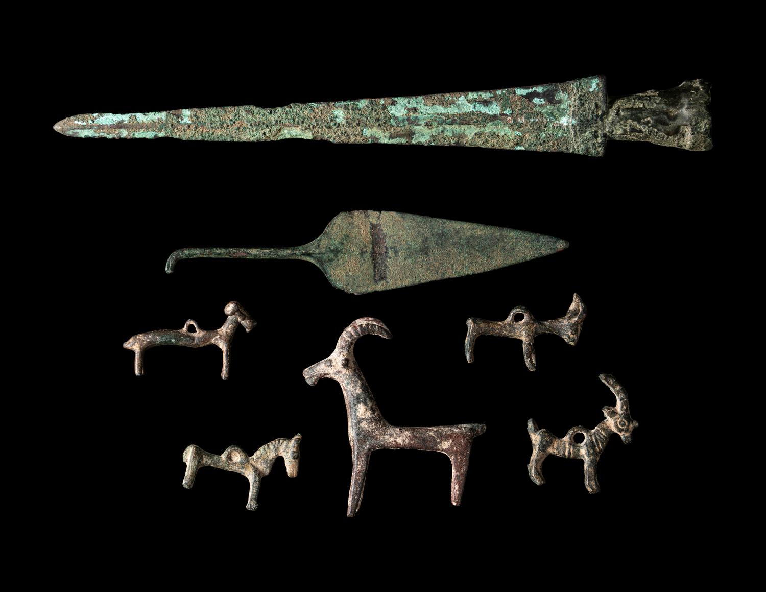 A Group of 7 Luristan Bronze Objects Including Animal Figures and Spearheads