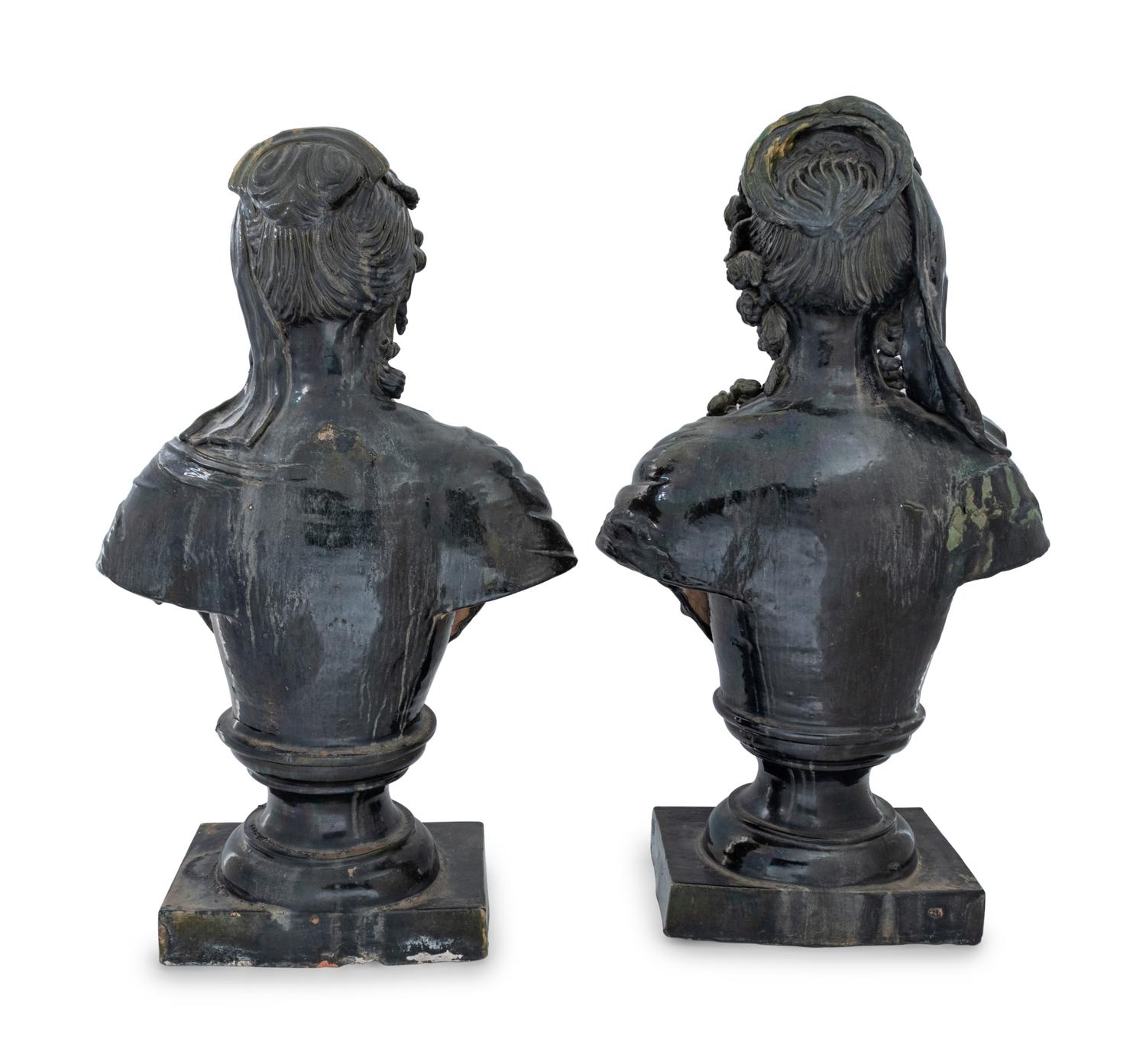 A Pair of French Green Glazed Terra Cotta Busts