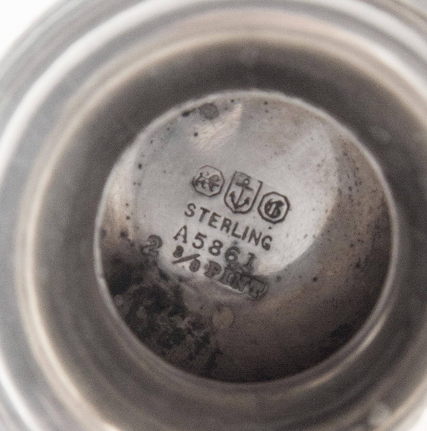 An American Silver Tyg, Gorham Mfg. Co., Providence, RI, the rim with a continuous foliate band, the body with an engraved monogram.