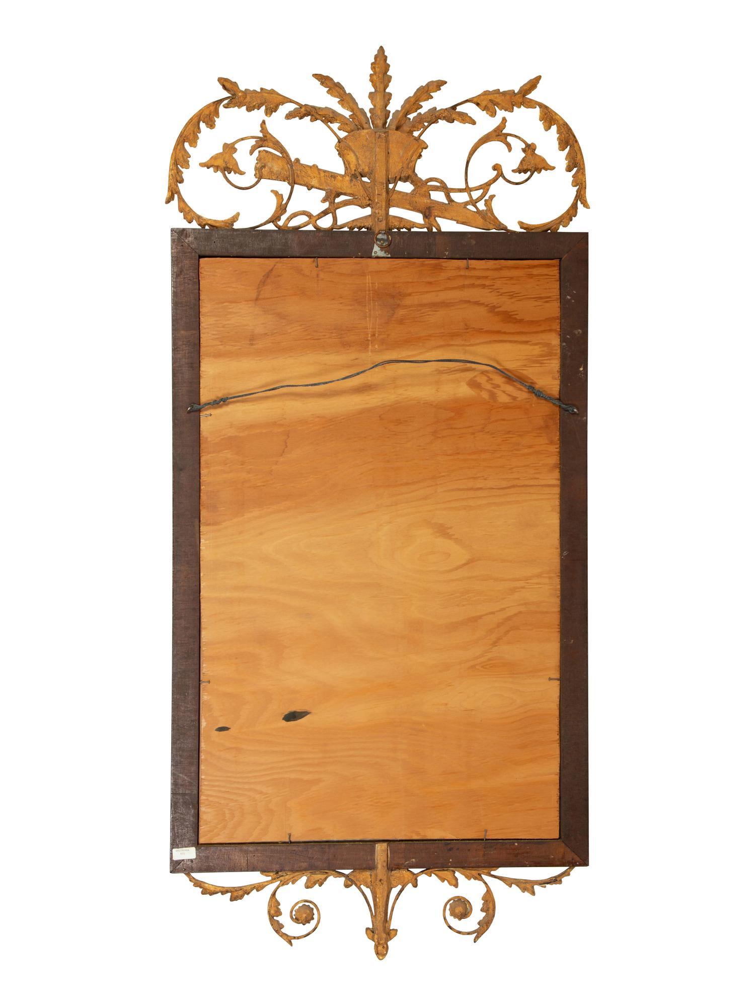 An Italian Neoclassical Style Giltwood and Mahogany Mirror