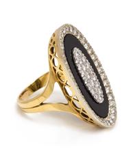 An 18 Karat Bicolor Gold, Diamond and Onyx Ring, 8.75 dwts.