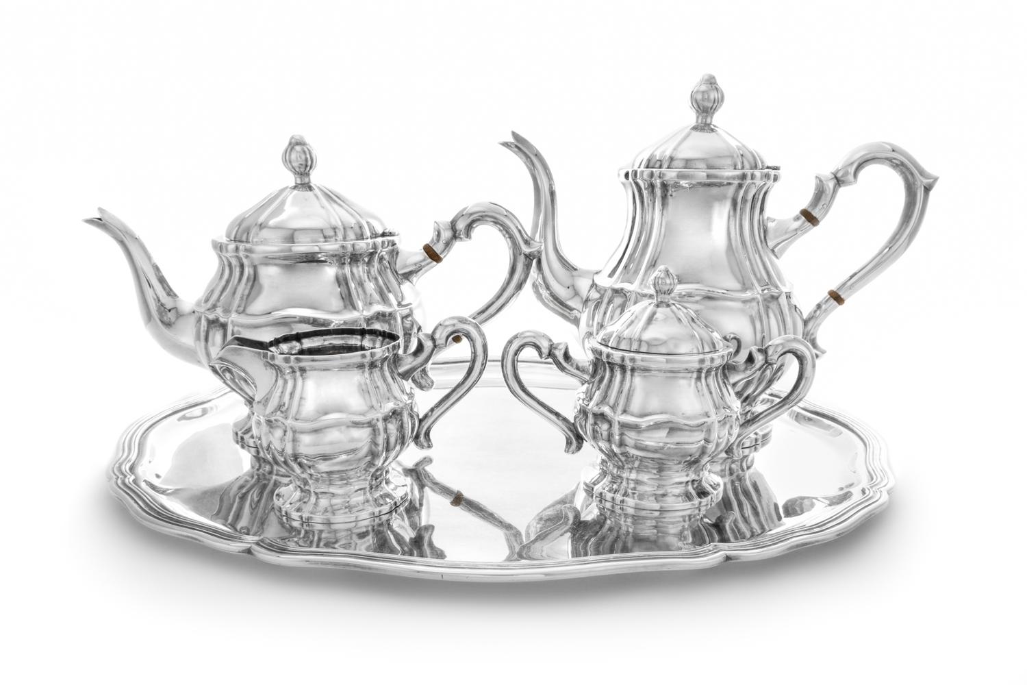 A Continental Five-Piece Silver Tea and Coffee Service, Maker's Mark E.C., comprising a teapot, coffee pot, creamer, covered sugar and