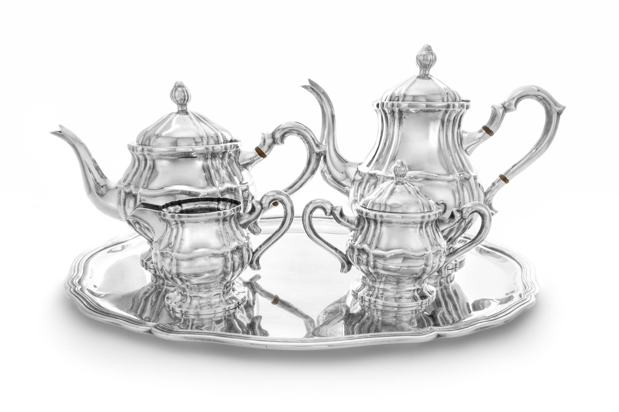 A Continental Five-Piece Silver Tea and Coffee Service, Maker's Mark E.C., comprising a teapot, coffee pot, creamer, covered sugar and