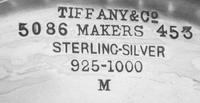 An American Silver Center Bowl, Tiffany & Co., New York, NY, the rim worked to show rocaille and C-scroll elements, the body having rep