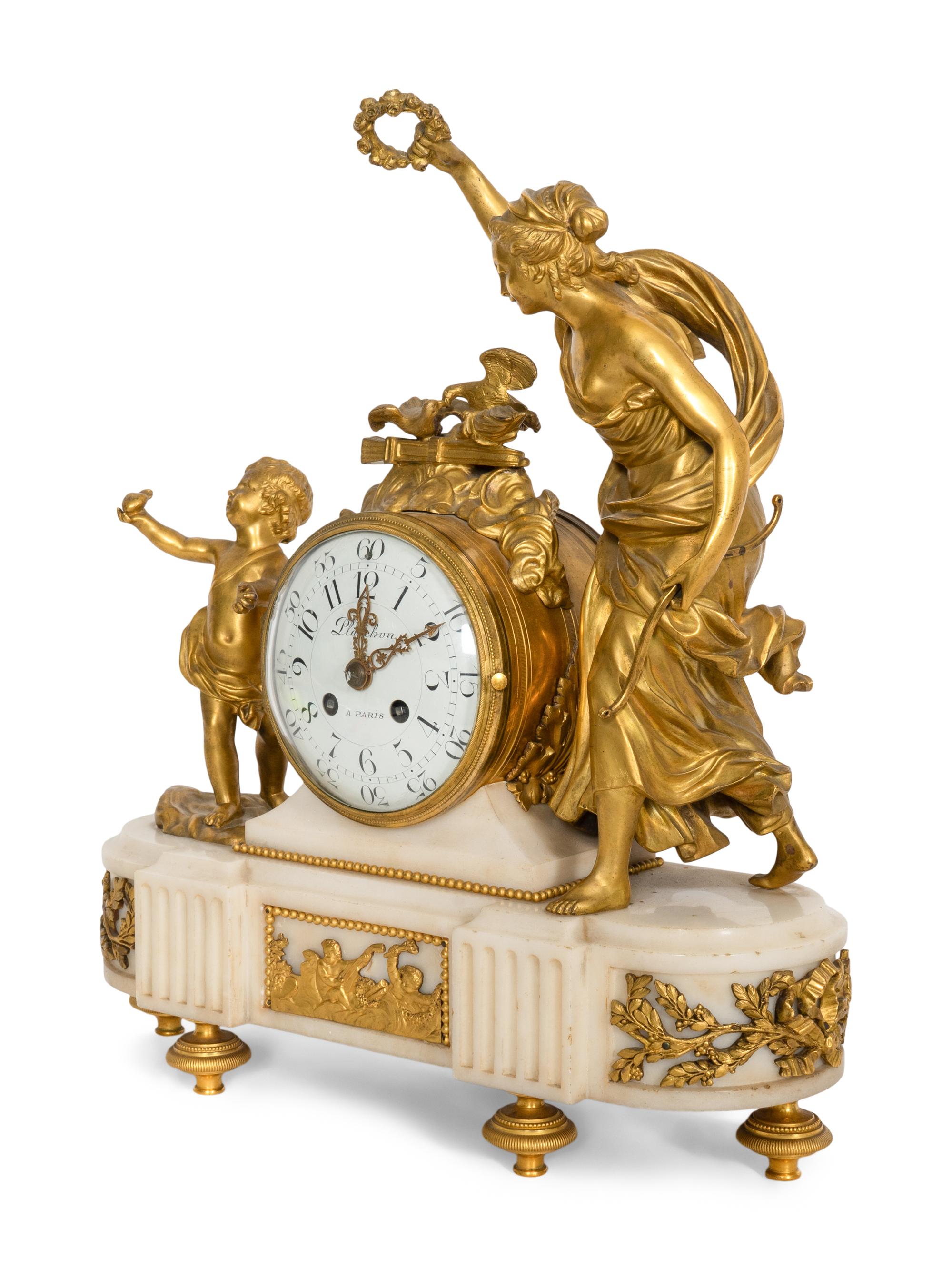 A Napoleon III Marble and Gilt Bronze Mounted Mantel Clock