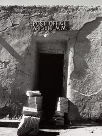 A group of four photographs ( Untitled (exterior wall) , 1960 (printed 1984); Georgia O'Keeffe in Twilight Canyon , 1964 (printed 1984); Untitled (Post Office, Abiquiu, NM), 1960 (printed 1984); O'Keeffe Sketching in Glen Canyon , 1961 (printed 1985)