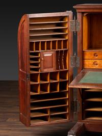A Carved Walnut Wooton Secretary Desk