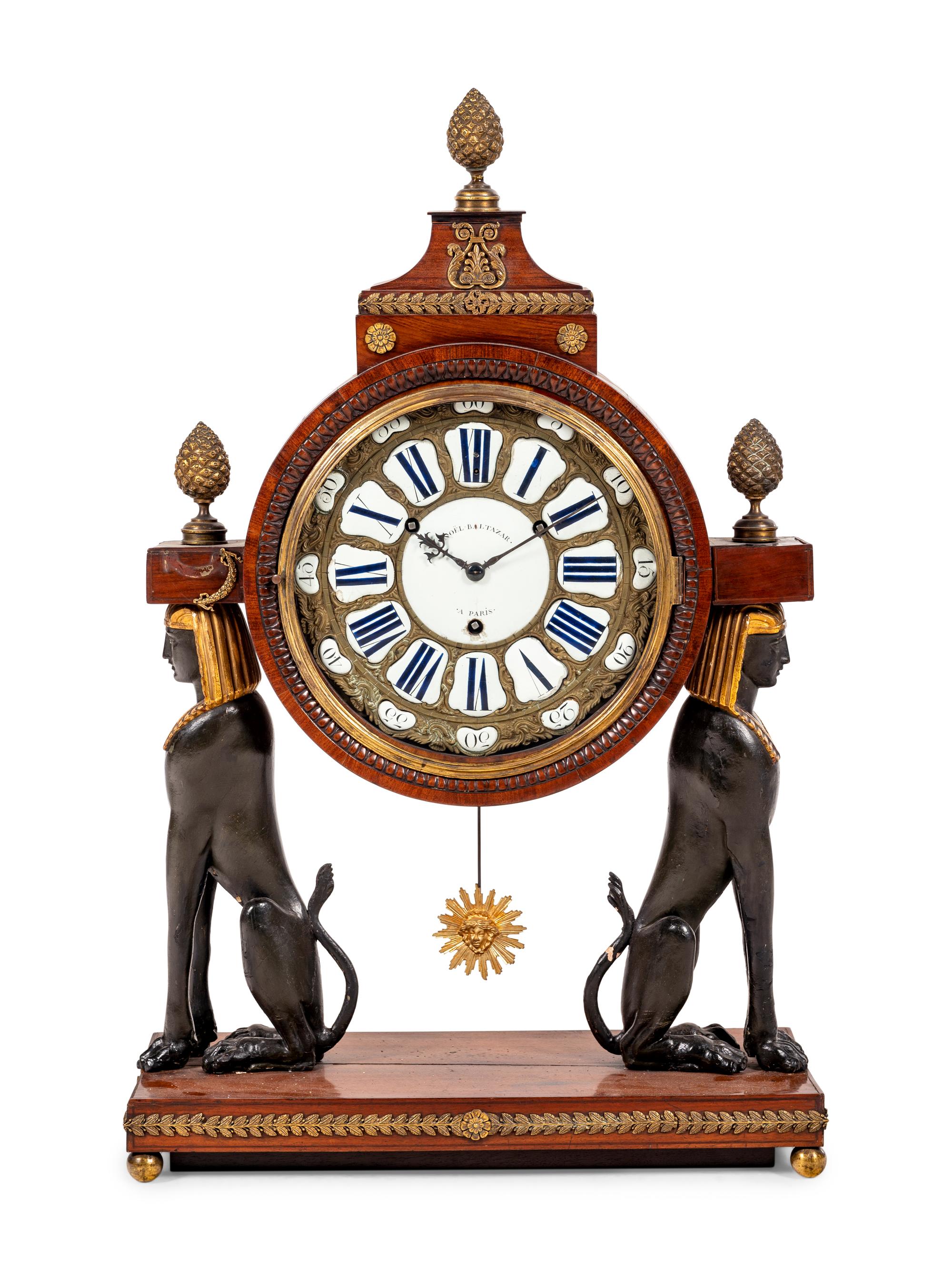 A French Egyptian Revival Gilt Bronze Mounted Mahogany Clock