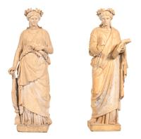 A Pair of Classical Style Statues Depicting Grecian Muses — AFTER THE ANTIQUE/ 20TH CENTURY