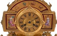 A French Neoclassical Gilt Bronze and Porcelain Plaque-Inset Clock Garniture