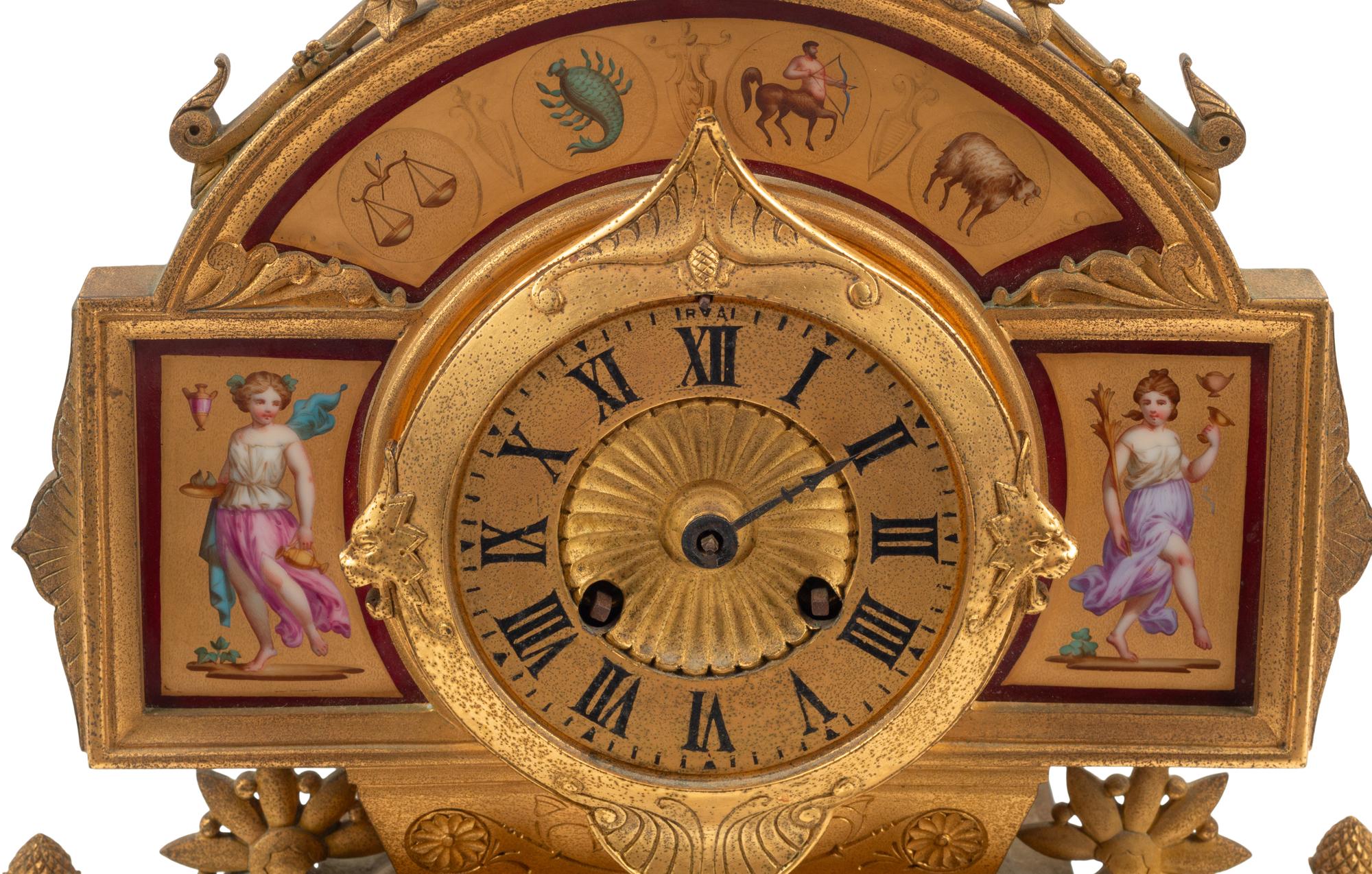 A French Neoclassical Gilt Bronze and Porcelain Plaque-Inset Clock Garniture