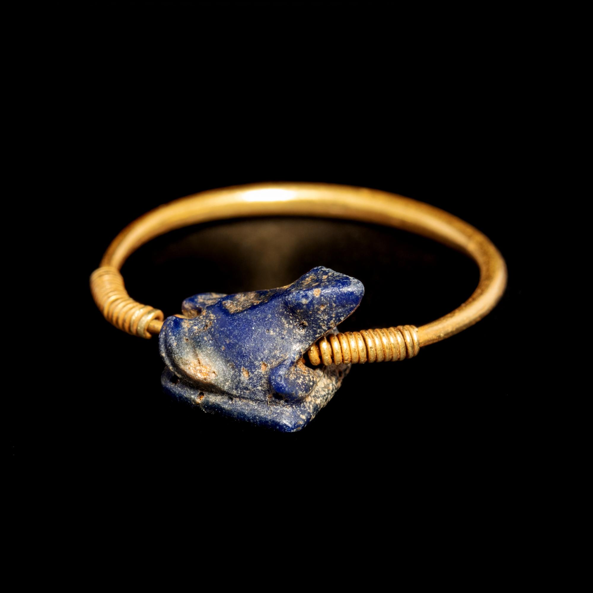 A Phoenician Gold Finger Ring with Blue Glass Frog Seal