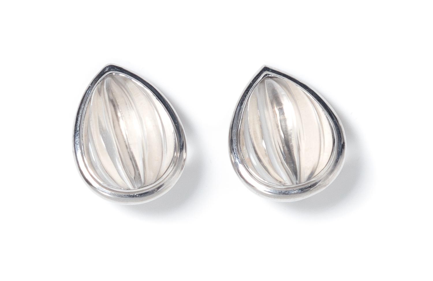 A Pair of 18 Karat White Gold and Carved Rock Crystal Earclips, White, 15.20 dwts.