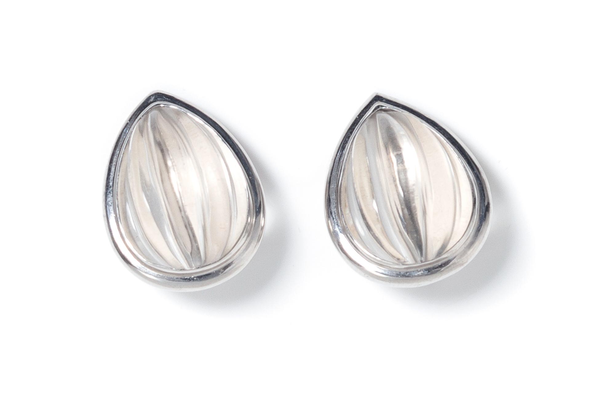 A Pair of 18 Karat White Gold and Carved Rock Crystal Earclips, White, 15.20 dwts.