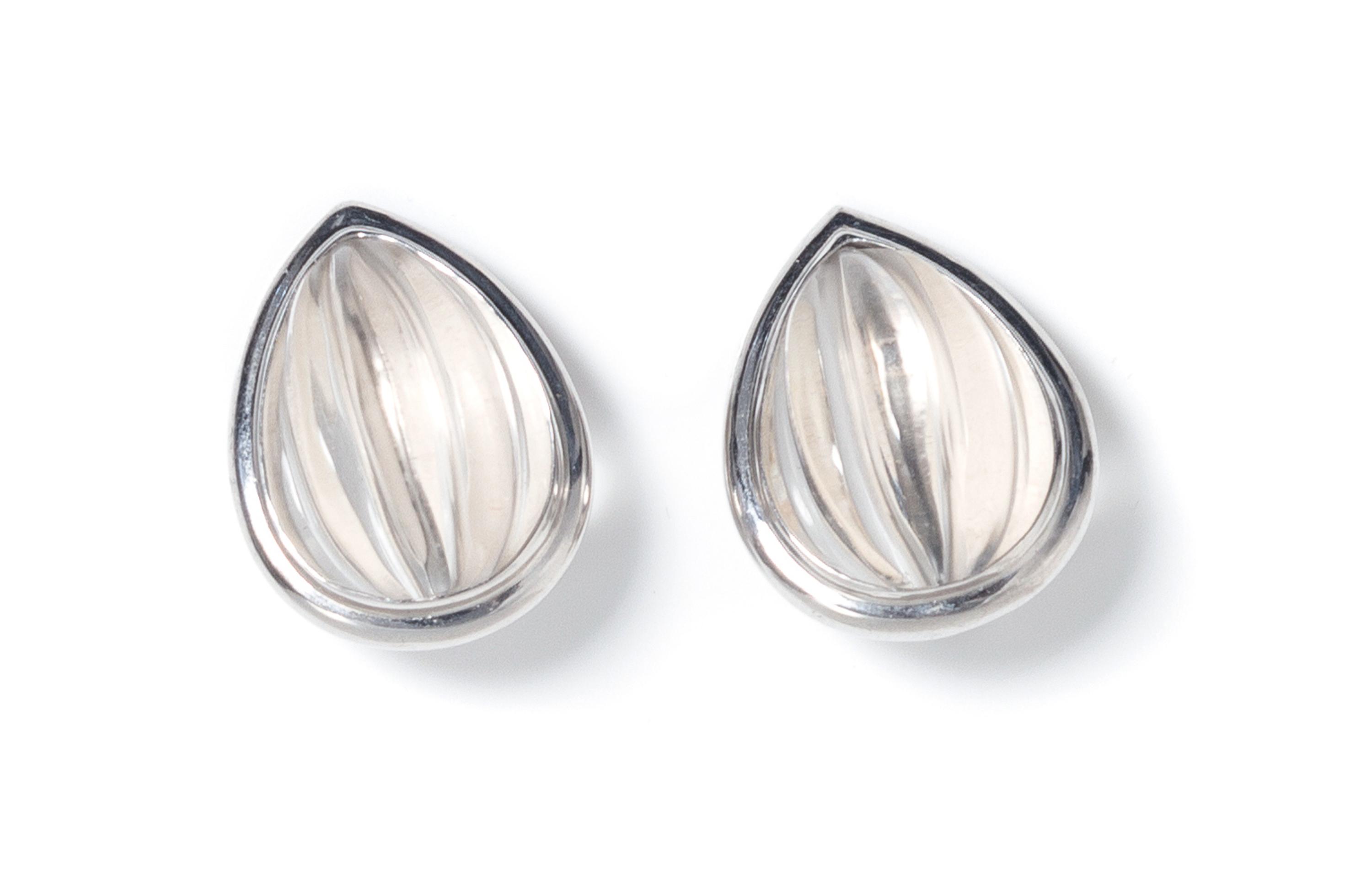 A Pair of 18 Karat White Gold and Carved Rock Crystal Earclips, White, 15.20 dwts.