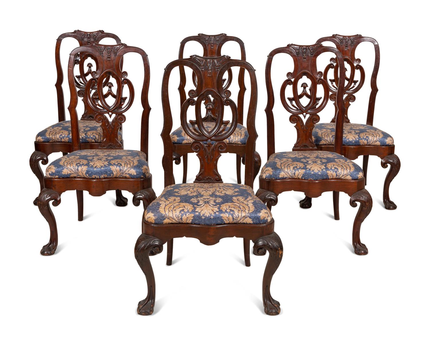 A Set of Twelve Continental Walnut Dining Chairs